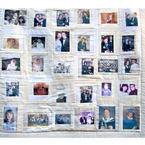 Wedding Quilt - This display quilt commemorates a wedding and includes childhood and family photographs of the couple, as well as pictures from the wedding day itself and pieces of lace from the bride's dress.